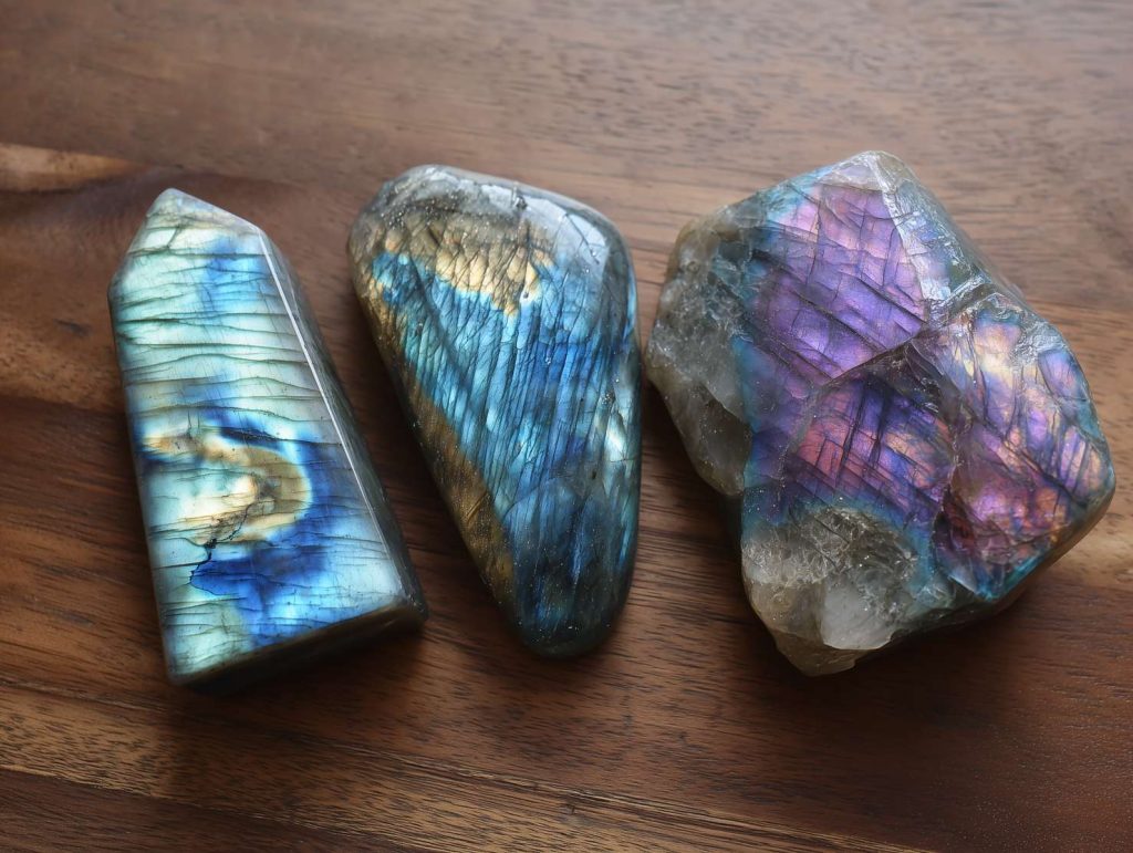 3_different_color_Labradorite_stone_on_table