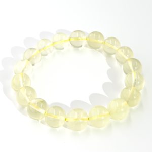 Soft lemon quartz bracelet with round polished beads in a pale yellow translucent tone