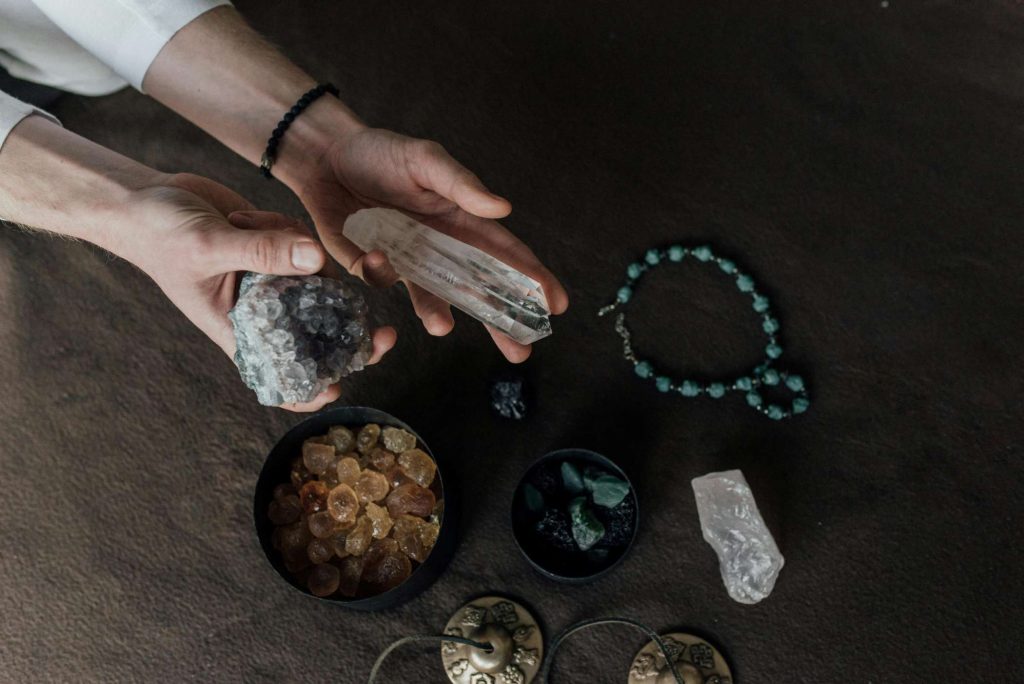 person-holding-healing-crystals-Photo-by-Arina-Krasnikova