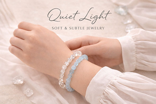 Woman wearing Quiet Light gemstone bracelets on the wrist, featuring soft pale tones and a calm, minimal aesthetic.