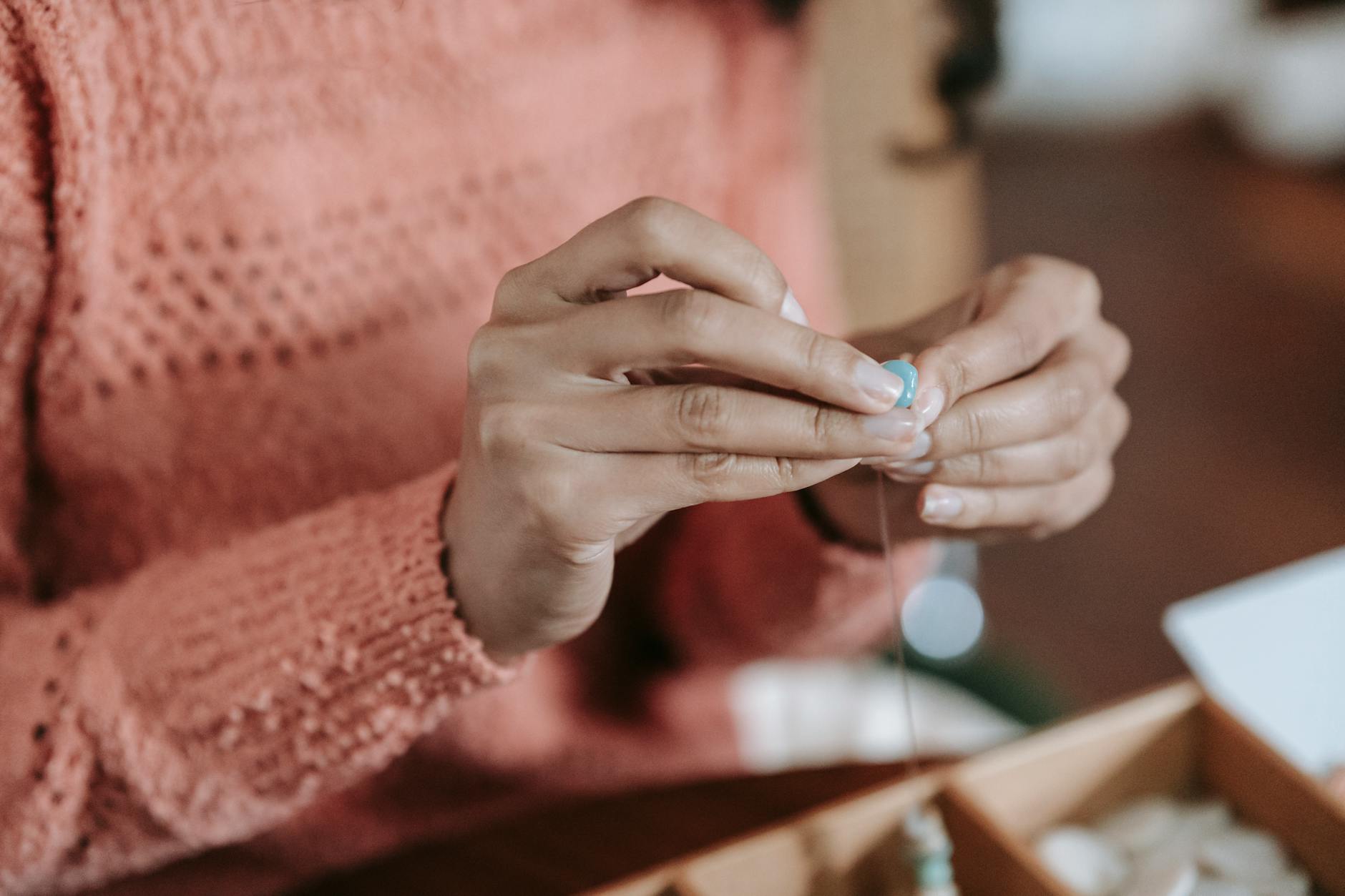 Macro shot of a frayed elastic cord on a crystal bracelet-photo-by-pexels