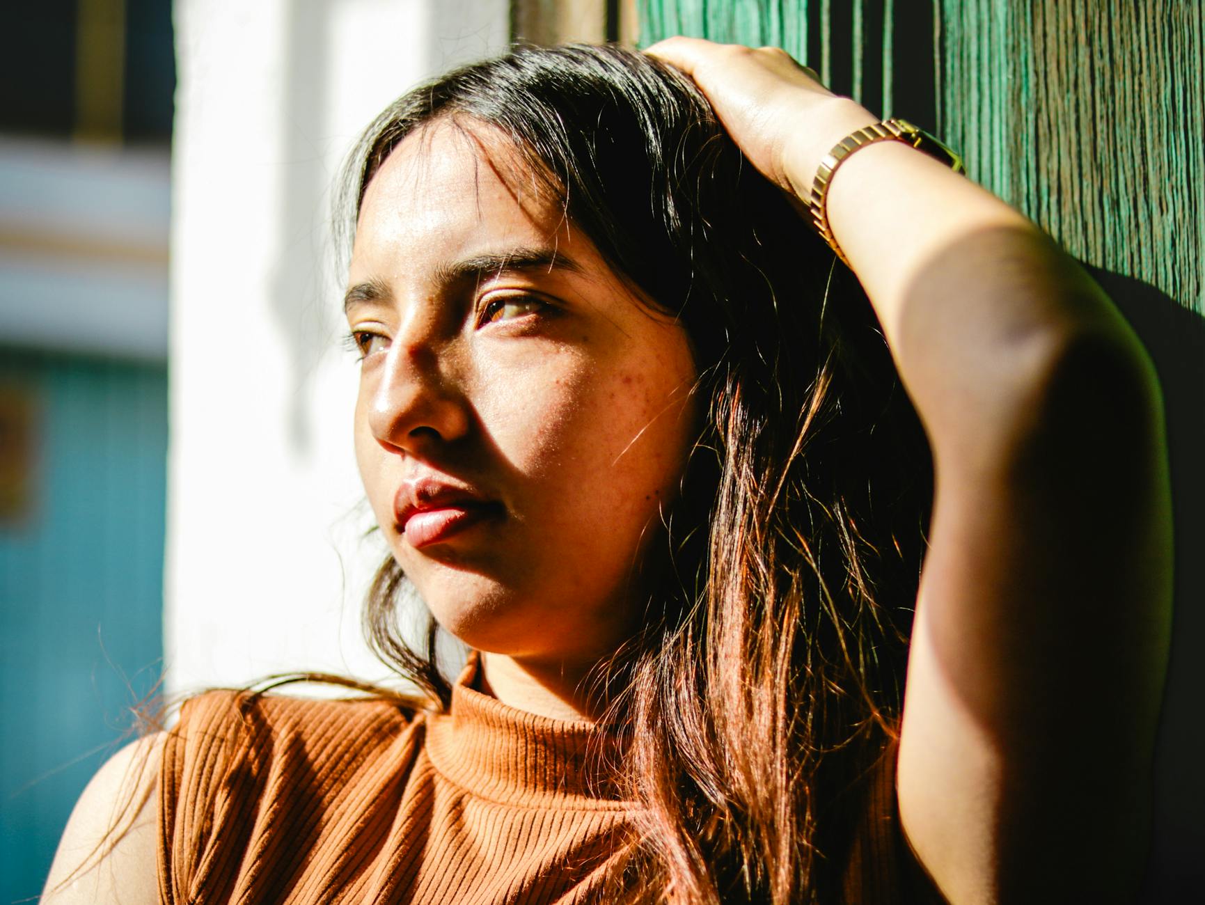 Close-up of a malachite bracelet on a wrist showing green swirling patterns and texture-photo-by-pexels
